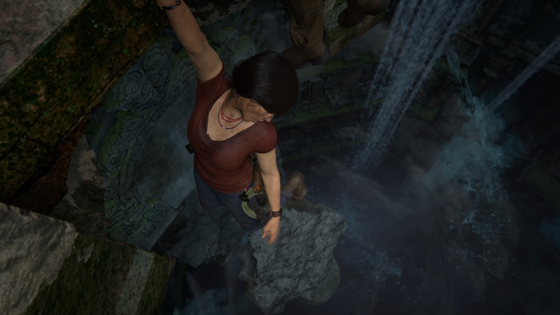 Chloe Frazer hanging on to an edge overhanging water